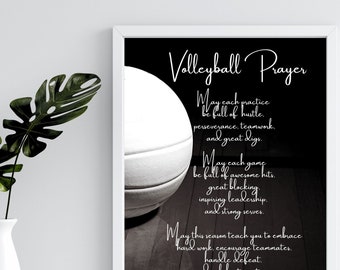 May include: A framed black and white print featuring a volleyball and the text "Volleyball Prayer." The prayer includes phrases about hustle, teamwork, awesome hits, leadership, and celebrating victories. The print is in a white frame.