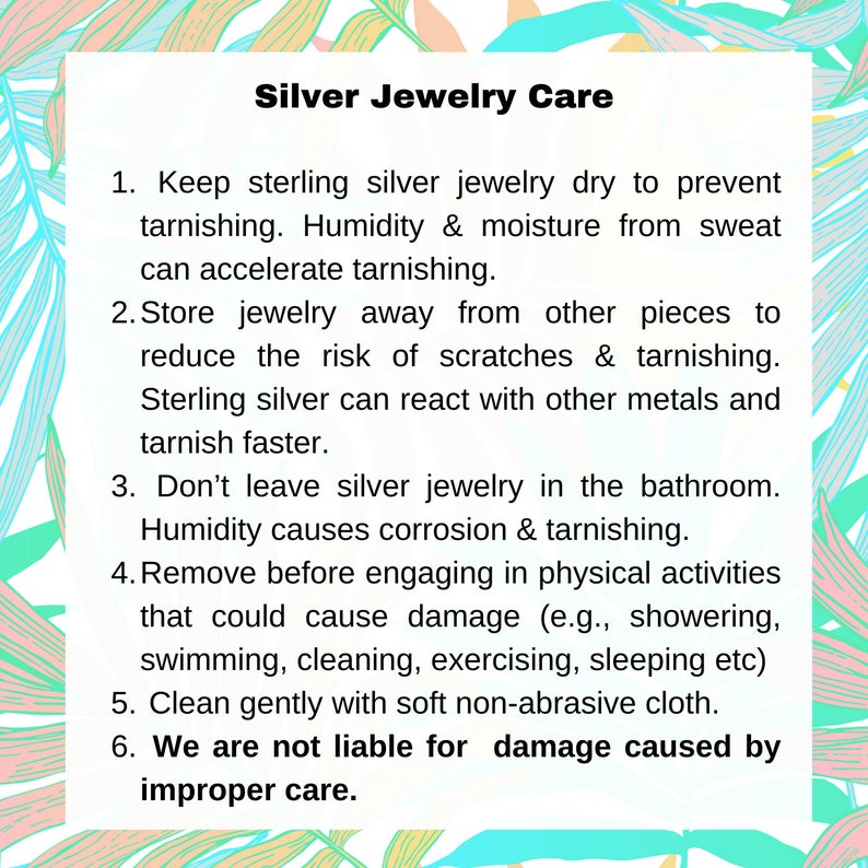 May include: White card with text "Silver Jewelry Care" and care instructions for sterling silver jewelry. Includes tips on preventing tarnish, storing jewelry, and cleaning. The background has a colorful tropical leaf design.