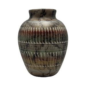 May include: A rounded ceramic vase featuring a smooth, matte finish with a multi-colored gradient of muted earth tones. The surface is decorated with intricate black horsehair-style markings and horizontal bands of white geometric patterns.