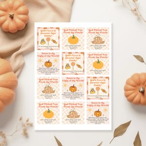 May include: A sheet of square stickers with fall-themed designs. Each sticker features a pumpkin graphic and text such as "God's Love is Sweeter than Candy!" and "Jesus is the Light of the World!" The stickers have a beige and orange color scheme.
