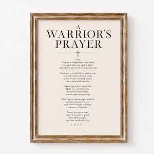 May include: A framed wall art print featuring the text A WARRIOR'S PRAYER in black serif font on a cream background. Below the title is a small sword icon followed by the full text of the prayer, ending with the word AMEN in a rustic wooden frame.