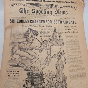 May include: A black and white cartoon illustration of a Native American man holding a pot and stirring a liquid with a stick. The man is wearing a loincloth and moccasins. The caption reads "Indians' Medicine Man in Motion".