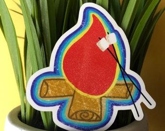 Könnte beinhalten: Ein bunter Aufkleber mit einer Cartoon-Illustration eines Lagerfeuers mit zwei Marshmallows auf Stöcken. Das Lagerfeuer ist rot, orange und gelb, und die Holzscheite sind braun. Der Aufkleber hat einen blauen, grünen und violetten Rand.