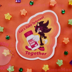 May include: A sticker featuring a cartoon character holding a bottle of Tylenol. The sticker has the text "Let's Take Tylenool Together". The background is orange with scattered star, moon, and gem-shaped decorations.