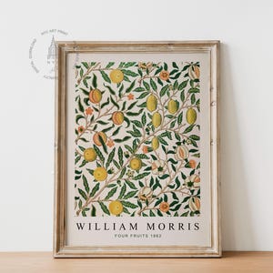 May include: A framed print of a vintage botanical illustration featuring a repeating pattern of green leaves, orange and yellow fruits, and pink flowers. The print is titled "William Morris Four Fruits 1862".