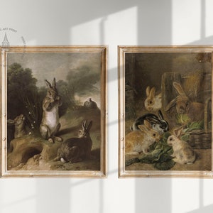 May include: Two framed vintage paintings of rabbits. The first painting shows a group of rabbits in a forest setting. The second painting shows a group of rabbits in a barn setting.