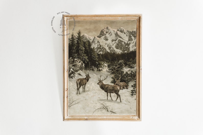 May include: A vintage print depicting a snowy mountain landscape with three deer in the foreground. The deer are brown and have antlers. The mountains are snow-capped and the trees are bare.