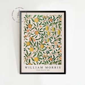 May include: A vintage botanical print featuring a repeating pattern of green leaves, pink flowers, and yellow and orange fruits. The print is framed in black and has the text "William Morris Four Fruits 1863" at the bottom.