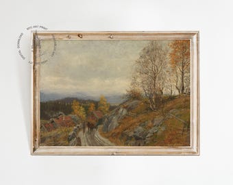 May include: An antique landscape painting in a gold-toned wooden frame. The artwork depicts a rural scene with a road, houses, and trees in autumn colors. The sky is overcast, and the overall mood is serene.