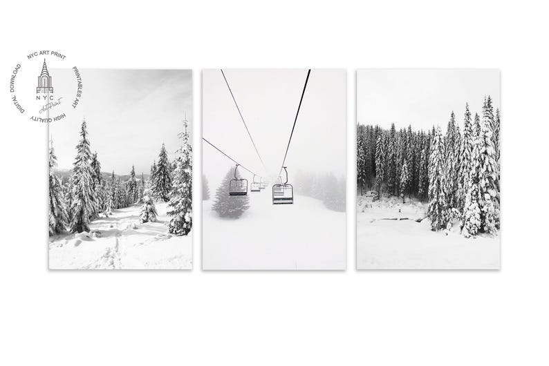 May include: A triptych of black and white winter landscape prints. The left panel shows snow-covered trees and a path. The center panel depicts a ski lift. The right panel features a snow-covered forest. The prints are from NYC Art Print.