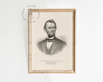 May include: Framed vintage print of Abraham Lincoln in a black and white portrait. The image features a bust of Lincoln in a suit and bow tie. The print is in a light brown wooden frame and includes the text "ABRAHAM LINCOLN, THE NATION'S MARTYR."