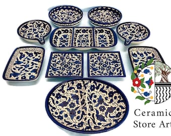May include: A set of nine ceramic serving dishes with blue and white floral patterns. The dishes are various shapes and sizes, including round, oval, and rectangular. The dishes are perfect for serving appetizers, desserts, or other small dishes.