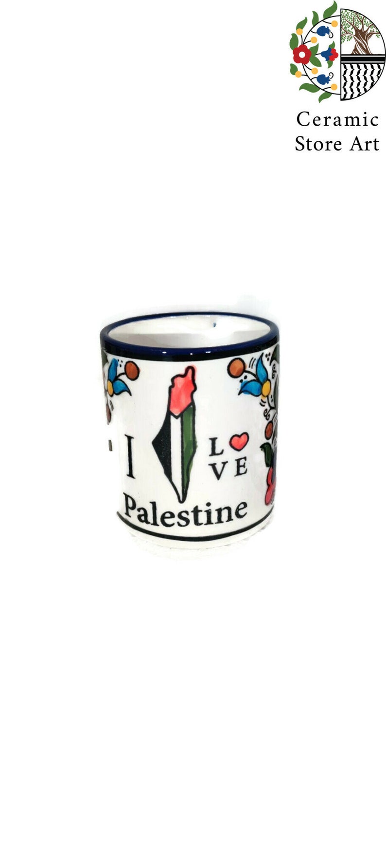 May include: White ceramic mug with a blue rim and a colorful floral design. The mug features a stylized outline of Palestine with the Palestinian flag colors and the text "I Love Palestine".