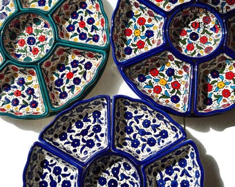 May include: Three ceramic serving dishes with intricate floral patterns. The dishes are divided into sections, perfect for serving appetizers or snacks. The dishes are blue, green, and white with red and yellow accents.