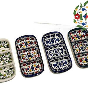May include: Four ceramic serving dishes with three divided sections. The dishes are decorated with floral and olive branch patterns in blue, green, red, and yellow.