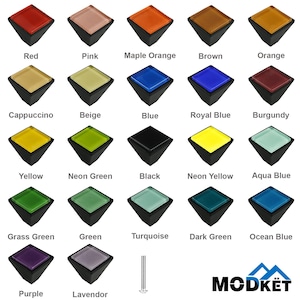 May include: A collection of twenty-one cabinet knobs in various colors, including red, pink, and blue. Each knob has a square, colored glass top and a black base. The image also includes the brand name "MODKET".