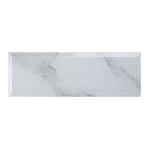 May include: White glass subway tile with a subtle gray marble pattern and beveled edges.