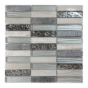 May include: A mosaic tile sheet with a mix of white, gray, and silver glass and marble tiles. The tiles have different textures, including wavy, textured, and metallic.