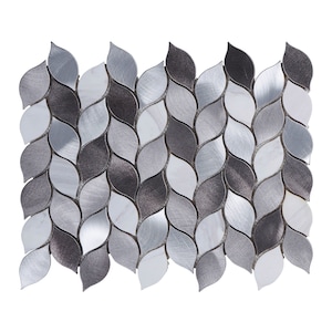 May include: A mosaic tile sheet featuring a repeating pattern of leaf-shaped tiles. The tiles are a mix of silver, gray, and white, with a brushed metal texture. The design creates a modern and elegant look, suitable for various interior design projects.