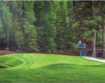 May include: A scenic painting of a golf course with lush green fairways and trees. A stone bridge and a small structure are visible in the background. The artwork captures the serene atmosphere of a golf course.