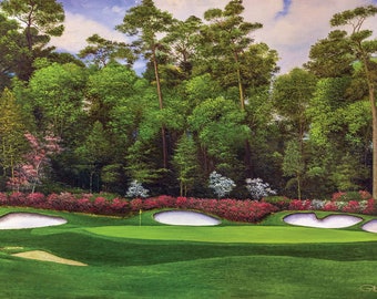 May include: A green golf course with a white sand bunker and a green putting surface. The course is surrounded by a lush forest with pink and white flowers.