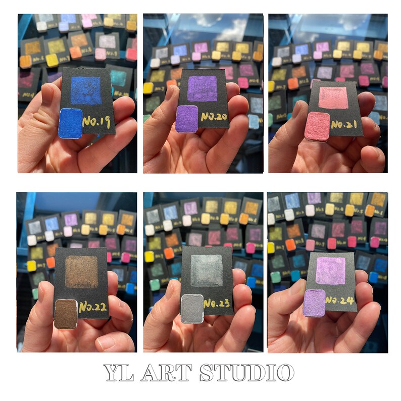 May include: A close-up of a set of 10 small paint samples, each in a black square with a gold number and label. The colors are blue, purple, pink, brown, gray, and light purple.