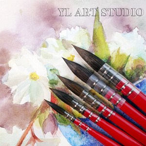 May include: A set of five red handled watercolor paint brushes with black bristles. The brushes are arranged in a fan shape on a watercolor painting of white flowers.