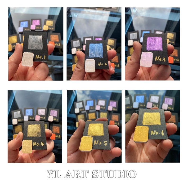 May include: Six small squares of metallic paint in various colors, including silver, blue, purple, gold, and yellow. Each square is labeled with a number, from 1 to 6. The paint is displayed on black card stock with gold lettering. The image is labeled "YL ART STUDIO".