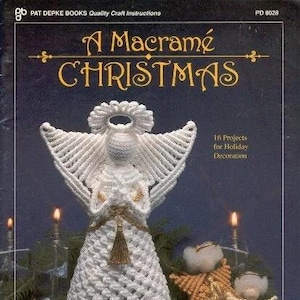 May include: A white macrame angel ornament with a gold tassel. The angel is a Christmas decoration and is part of a book titled "A Macrame Christmas" with 16 projects for holiday decoration.