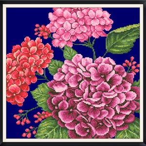 May include: A framed cross-stitch embroidery featuring a bouquet of pink, red, and purple hydrangeas on a dark blue background.