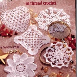 May include: A collection of white thread crochet doilies in various shapes, including a heart, square, and flower. The image also features a magnifying glass, a pocket watch, and other decorative elements. The text reads "A Dozen Tiny Doilies in thread crochet."