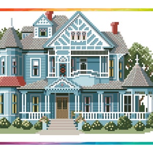 May include: A blue Victorian-style house with white trim and a large front porch. The house has a red roof and a white picket fence. There are green bushes and trees in the yard.