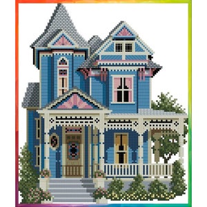 May include: A blue and pink Victorian style house with a white picket fence and green bushes. The house has a porch with a white railing and a front door with a wreath.