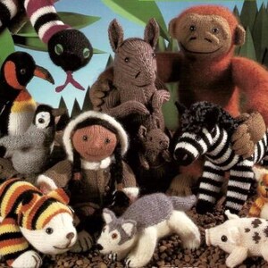 May include: A collection of knitted animal toys, including a penguin, a zebra, a monkey, a wolf, a pig, a tiger, a kangaroo, and a snake. The toys are all made with different colored yarn and have realistic features.