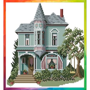 May include: A cross-stitch pattern of a teal green Victorian house with a white door and a porch. The house has a tower with a pointed roof and a large tree with a swing in the front garden.