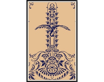 May include: A framed cross-stitch design featuring a stylized floral pattern in navy blue on a beige background.