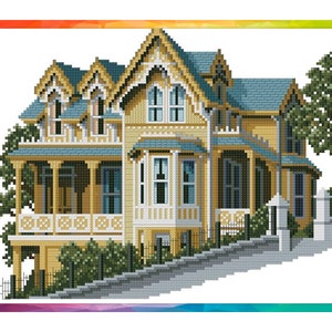 May include: A yellow Victorian-style house with a wraparound porch and a steep, gabled roof. The house is surrounded by lush green trees and bushes.