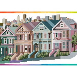 May include: A cross-stitch pattern of a row of colorful Victorian houses with a cityscape in the background.