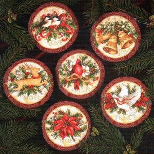 May include: Six round Christmas ornaments with different designs. The ornaments feature a cardinal, a reindeer, a dove, a poinsettia, a pair of birds, and a set of bells. The ornaments are all decorated with greenery and red berries.