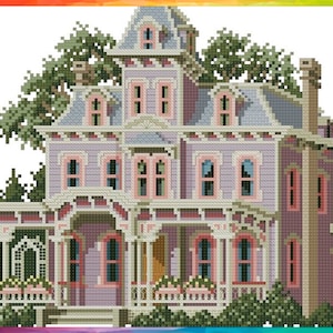 May include: A detailed cross-stitch pattern of a large, multi-story Victorian house with a wraparound porch, surrounded by lush green trees. The house is painted in shades of pink and gray with white trim.
