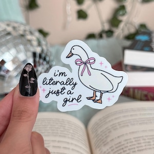 May include: White goose sticker with a pink bow and the text "i'm literally just a girl" on a white background.