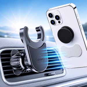 May include: A black car air vent phone mount with a U-shaped cradle and a circular base, featuring the text "KEGIGY" embossed on the front. A white smartphone with a black circular grip and a silver adhesive plate is positioned next to the mount.
