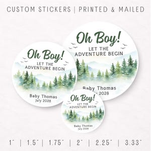 May include: White round stickers with a watercolor forest design and the text "Oh Boy! Let the Adventure Begin." The stickers include the name "Baby Thomas" and the date "July 2028." Sizes range from 1 inch to 3.33 inches.