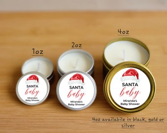 May include: Three sizes of Santa Baby themed candles in silver and gold tins. The candles are 1 ounce, 2 ounces, and 4 ounces. The 4 ounce candle is available in black, gold, or silver.