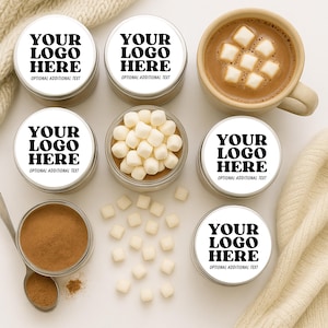 May include: An overhead shot features a mug of hot chocolate with marshmallows, surrounded by small containers of cocoa powder and marshmallows. The containers have labels that read "YOUR LOGO HERE" and "OPTIONAL ADDITIONAL TEXT". A spoon rests near the cocoa.