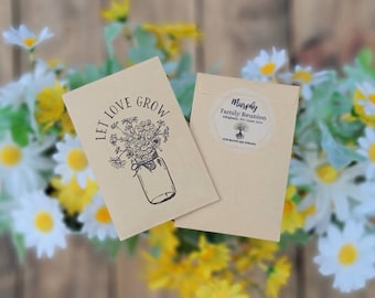 May include: A kraft paper envelope with a sticker that says "Murphy Family Reunion Alleghany, NY | June 2023 Our Roots Are Strong". The envelope is open to reveal a smaller kraft paper envelope with a black and white illustration of a mason jar filled with wildflowers and the text "Let Love Grow".