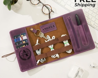 May include: Purple leather tech organizer with brown interior, holding cables, keys, and cards. Features a zipper pocket and the name "ANGELA". Includes a pen and the text "Same Day FREE Shipping".