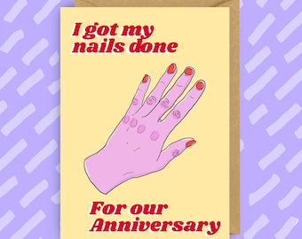May include: A yellow card with the text "I got my nails done" in red and "For our Anniversary" in red. A pink hand with red nail polish is shown on the card.