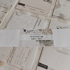 May include: A set of blank journaling cards with a vintage aesthetic. The cards feature a variety of designs, including a map, a grid, and a blank postcard. The cards are perfect for journaling, scrapbooking, or card making.