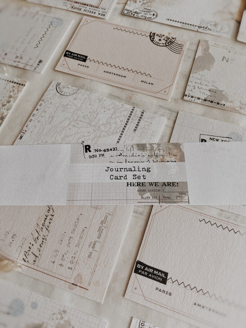 May include: A set of blank journaling cards with a vintage aesthetic. The cards feature a variety of designs, including a map, a grid, and a blank postcard. The cards are perfect for journaling, scrapbooking, or card making.